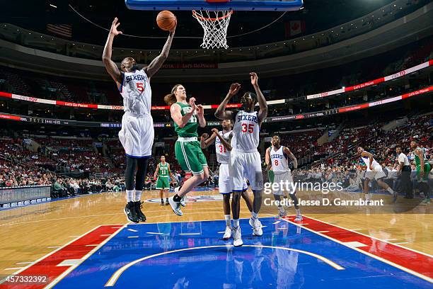 Arnett Moultrie of the Philadelphia 76ers grabs a rebound against the Boston Celtics on October 16, 2014 at Wells Fargo Center in Philadelphia,...