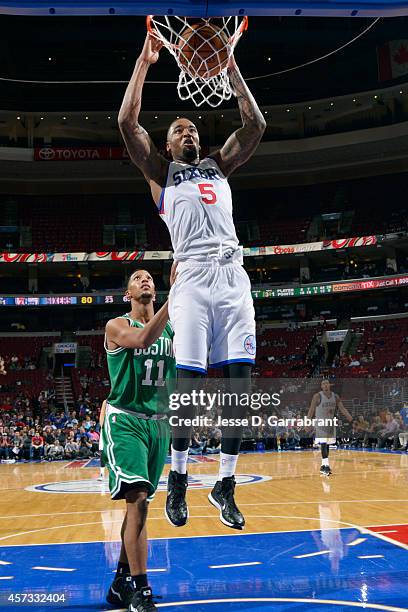 Arnett Moultrie of the Philadelphia 76ers dunks against the Boston Celtics on October 16, 2014 at Wells Fargo Center in Philadelphia, Pennsylvania....