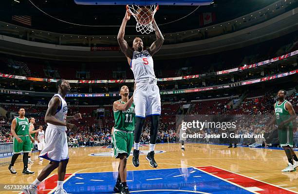 Arnett Moultrie of the Philadelphia 76ers dunks against the Boston Celtics on October 16, 2014 at Wells Fargo Center in Philadelphia, Pennsylvania....