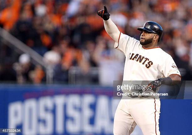 Pablo Sandoval of the San Francisco Giants reacts after a fourth inning double while taking on the St. Louis Cardinals during Game Five of the...