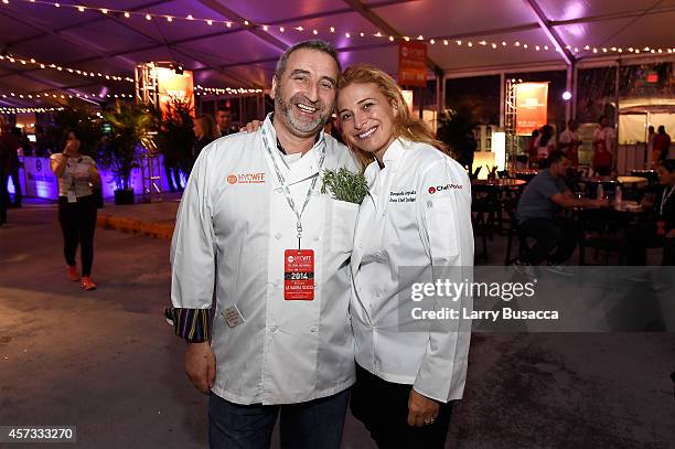 Chef Cesare Casella and Chef Donatella Arpaia pose at Ronzoni's La Sagra Slices hosted by Bongiovi Brand pasta sauces & Adam Richman presented by...