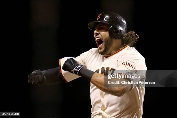 Michael Morse of the San Francisco Giants celebrates after hitting a solo home run in the eighth inning against the St. Louis Cardinals during Game...