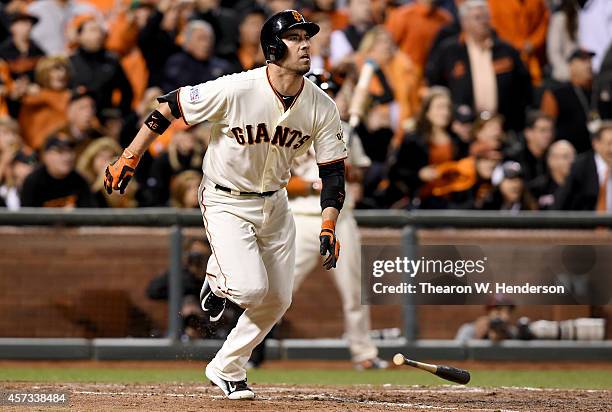 Travis Ishikawa of the San Francisco Giants hits a three-run walk-off home run to defeat the St. Louis Cardinals 6-3 during Game Five of the National...