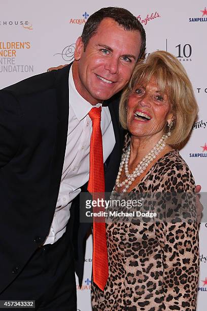 Wayne Carey and Lilian Frank pose at the 10th anniversary celebration of The Million Dollar Lunch at the Park Hyatt on October 17, 2014 in Melbourne,...