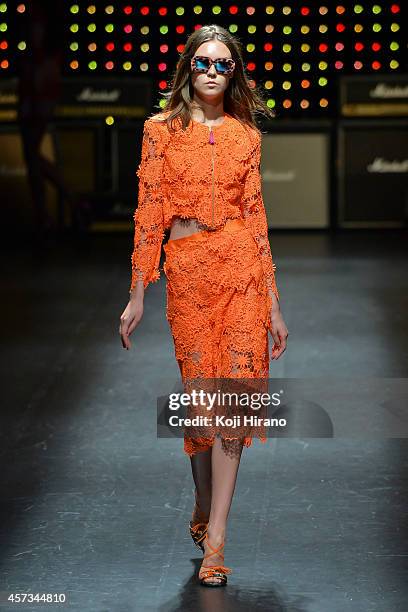 Model showcases designs on the runway during the House of Holland show as part of Mercedes Benz Fashion Week TOKYO 2015 S/S at Shibuya Hikarie on...