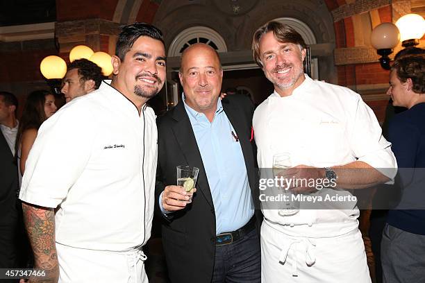 Chef Aaron Sanchez, tv personality Andrew Zimmern, and chef John Besh pose at the Johnny Sanchez Dinner hosted by John Besh, Aaron Sanchez and Katy...