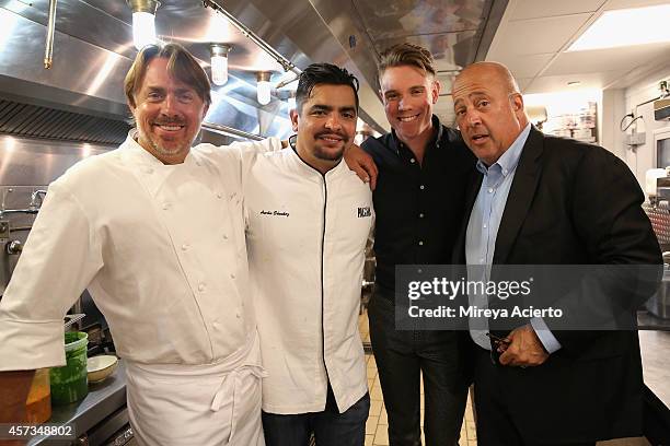 Chefs John Besh and Aaron Sanchez , tv personality Andre Zimmern and a guest pose at the Johnny Sanchez Dinner hosted by John Besh, Aaron Sanchez and...