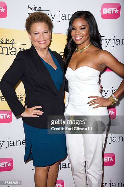 Debra Lee and Gabrielle Union attend the New Series "Being Mary Jane" Los Angeles Premiere on December 16, 2013 in Los Angeles, California.