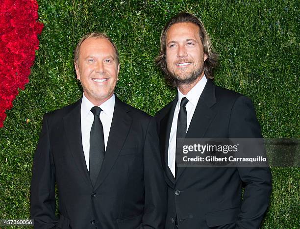 Designer Michael Kors and Lance LePere attend the 2014 God's Love We Deliver Golden Heart Awards at Spring Studios on October 16, 2014 in New York...