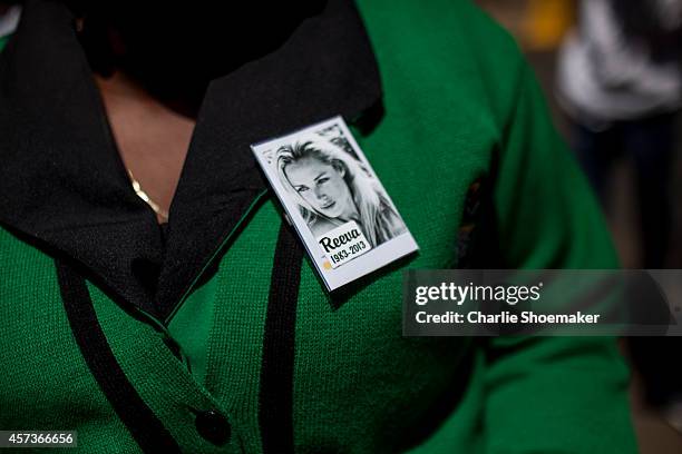 Member of the ANC Women's league wears a pin for Reeva Steenkamp leaves the North Gauteng High Court after the fifth day of sentencing of Oscar...