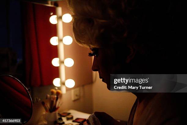 Ceri Dupree makes last minute adjustments to his make-up in his dressing room, before going on stage as Princess Passionella in Sleeping Beauty at...