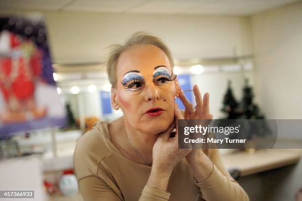 Pantomime Dame Nigel Ellacott attaches a microphone, in his dressing room at Venue Cymru Theatre where he is performing as Queen Blodwyn, in Sleeping...