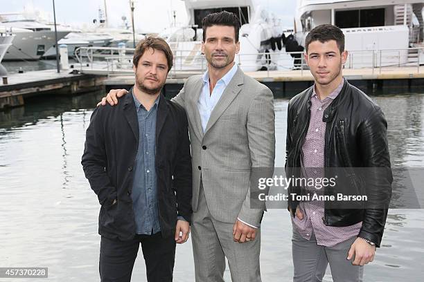 Frank Grillo, Byron Balasco and Nick Jonas pose for "Kingdom" Photocall during MIPCOM 2014 at Pantiero on October 14, 2014 in Cannes, France.