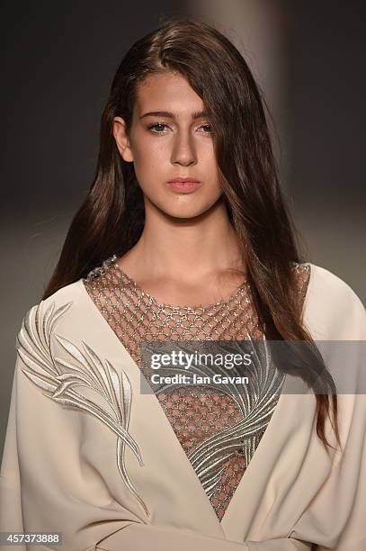 Model walks the runway at the Zeynep Erdogan show during Mercedes Benz Fashion Week Istanbul SS15 at Antrepo 3 on October 17, 2014 in Istanbul,...