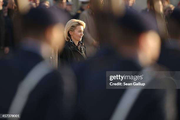 New German Defense Minister Ursula von der Leyen watches as Bundeswehr soldiers parade past shortly after she took office at the Defense Ministry on...