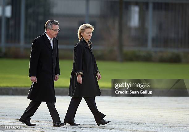 New German Defense Minister Ursula von der Leyen prepares to review soldiers of the Bundeswehr with outgoing Defense Minister Thomas de Maiziere...