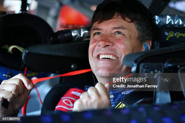 Michael Waltrip, driver of the MyAFibStory.com Toyota, prepares to drive during practice for the NASCAR Sprint Cup Series GEICO 500 at Talladega...