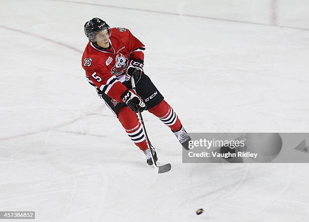 Blake Siebenaler of the Niagara Ice Dogs passes the puck during an OHL game between the Belleville Bulls and the Niagara Ice Dogs at the Meridian...