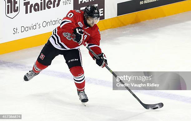 Anthony DiFruscia of the Niagara Ice Dogs passes the puck during an OHL game between the Belleville Bulls and the Niagara Ice Dogs at the Meridian...