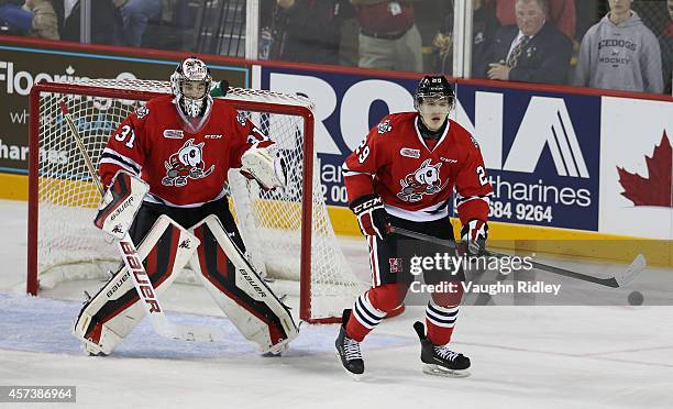 Brent Moran and Aleksandar Mikulovich of the Niagara Ice Dogs during an OHL game between the Belleville Bulls and the Niagara Ice Dogs at the...