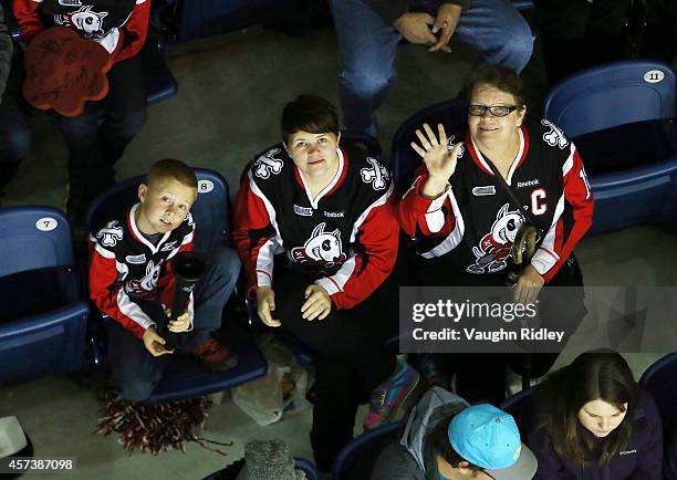 Fans wave during an OHL game between the Belleville Bulls and the Niagara Ice Dogs at the Meridian Centre on October 16, 2014 in St Catharines,...