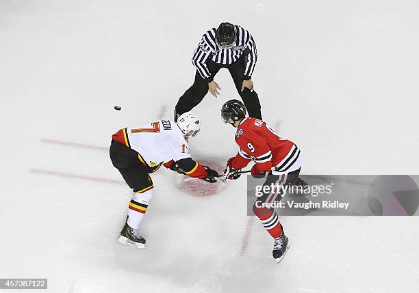 Brandon Saigeon of the Belleville Bulls and Jordan Maletta of the Niagara Ice Dogs face-off during an OHL game at the Meridian Centre on October 16,...