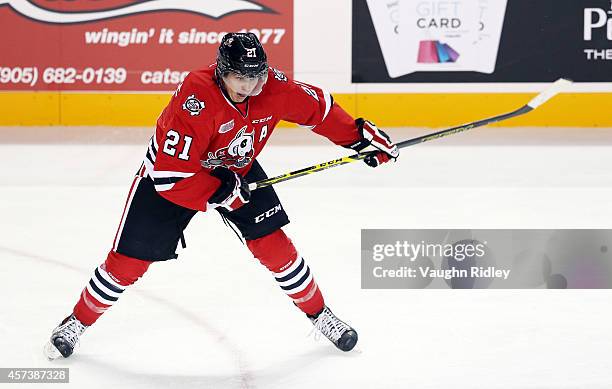 Carter Verhaeghe of the Niagara Ice Dogs shoots the puck during an OHL game against the Belleville Bulls at the Meridian Centre on October 16, 2014...
