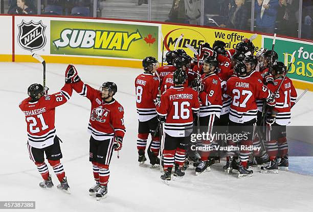 The Niagara Ice Dogs celebrate winning 7-4 in an OHL game against the Belleville Bulls at the Meridian Centre on October 16, 2014 in St Catharines,...