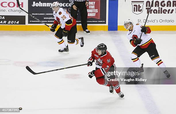Mikkel Aagaard of the Niagara Ice Dogs heads up the ice with Cole Candella of the Belleville Bulls during an OHL game against the at the Meridian...