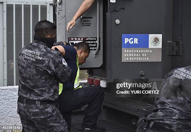 Attorney's General office's special agents custody some of the 27 municipal policemen involved in an attack against students in Iguala last month and...