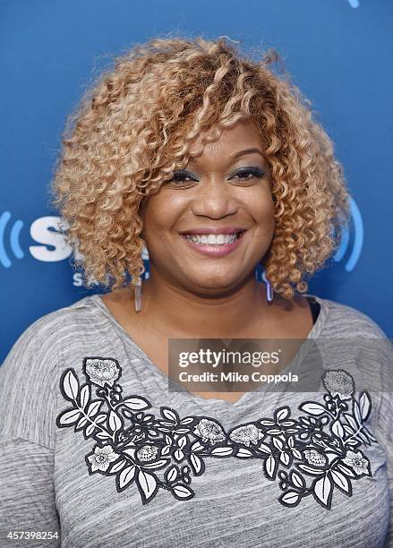 Food telelvision personality Sunny Anderson poses for a picture during her visit to SiriusXM's "Food Talk" on October 17, 2014 in New York City.
