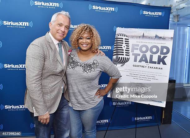 Chef and host Geoffrey Zakarian and Sunny Anderson pose for a picture during SiriusXM's "Food Talk" on October 17, 2014 in New York City.