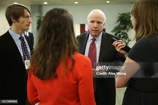 Sen. John McCain talks to a reporters after a vote December 17, 2013 on Capitol Hill in Washington, DC. The Senate has passed a cloture vote to clear...