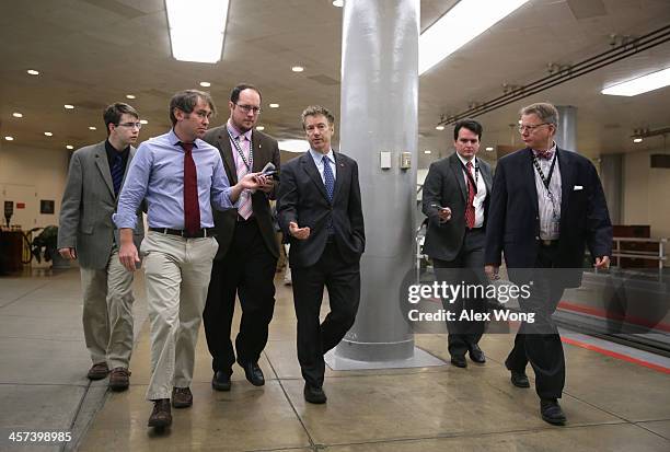 Sen. Rand Paul talks to reporters after a vote December 17, 2013 on Capitol Hill in Washington, DC. The Senate has passed a cloture vote to clear the...