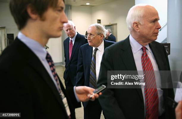 Sen. Saxby Chambliss , Sen. Carl Levin and Sen. John McCain walk after a vote December 17, 2013 on Capitol Hill in Washington, DC. The Senate has...