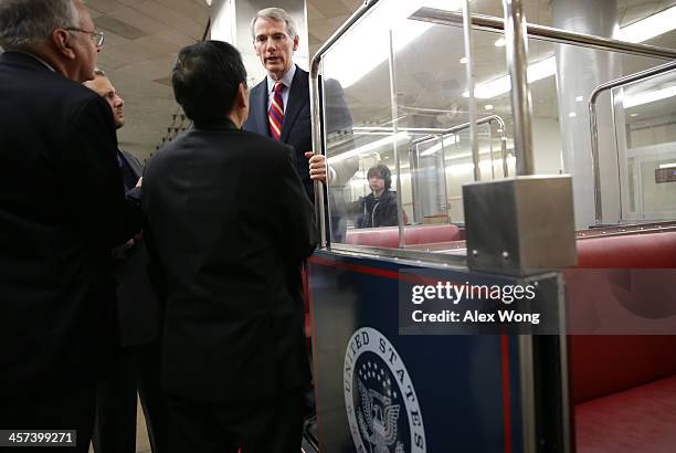 Sen. Rob Portman talks to reporters after a vote December 17, 2013 on Capitol Hill in Washington, DC. The Senate has passed a cloture vote to clear...