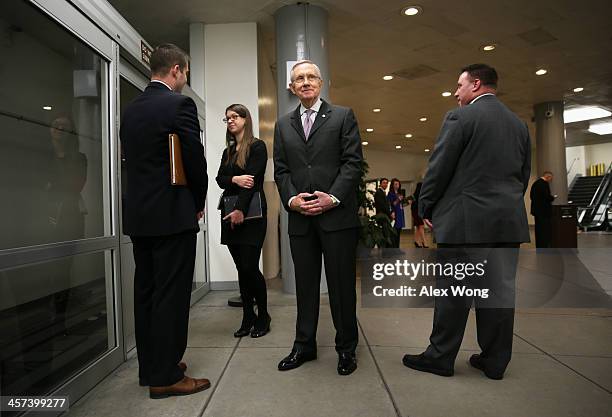 Senate Majority Leader Sen. Harry Reid waits for the Senate subway after a vote December 17, 2013 on Capitol Hill in Washington, DC. The Senate has...
