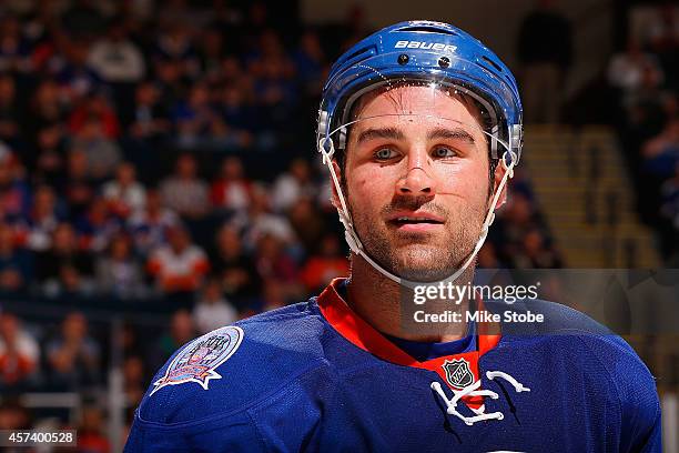 Johnny Boychuk of the New York Islanders skates against the Carolina Hurricanes at Nassau Veterans Memorial Coliseum on October 11, 2014 in...