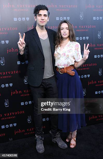 Personality Nick Simmons and guest attend the International Peace Day celebration at John Varvatos on September 21, 2014 in Los Angeles, California.