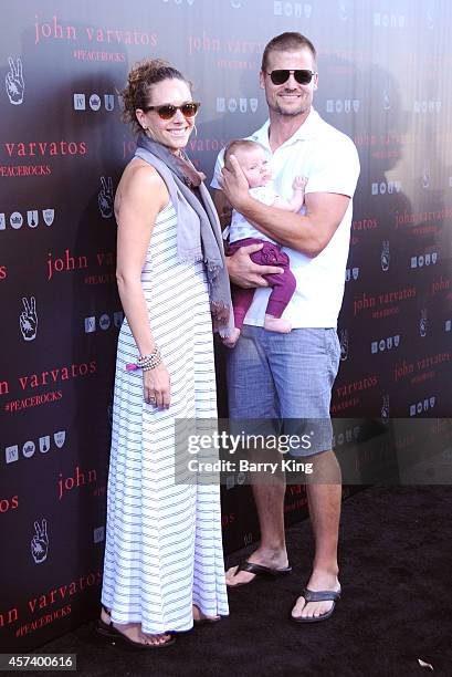 Amy Chase and Bailey Chase and baby attend the International Peace Day celebration at John Varvatos on September 21, 2014 in Los Angeles, California.