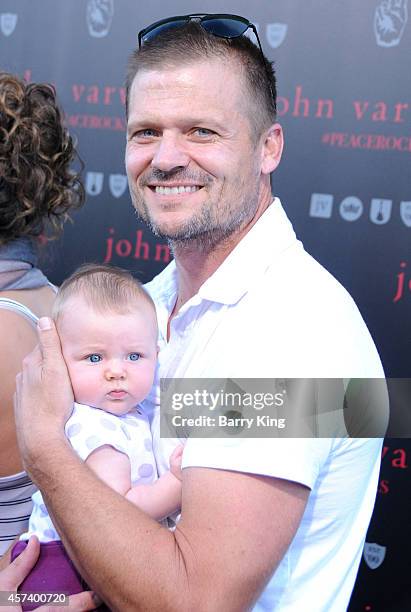 Actor Bailey Chase and baby attend the International Peace Day celebration at John Varvatos on September 21, 2014 in Los Angeles, California.