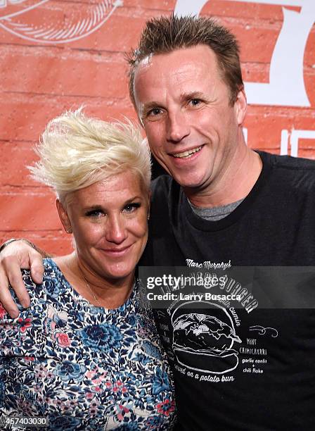 Chefs Anne Burrell and Marc Murphy pose together at the Blue Moon Burger Bash presented by Pat LaFrieda Meats hosted by Rachael Ray during the Food...