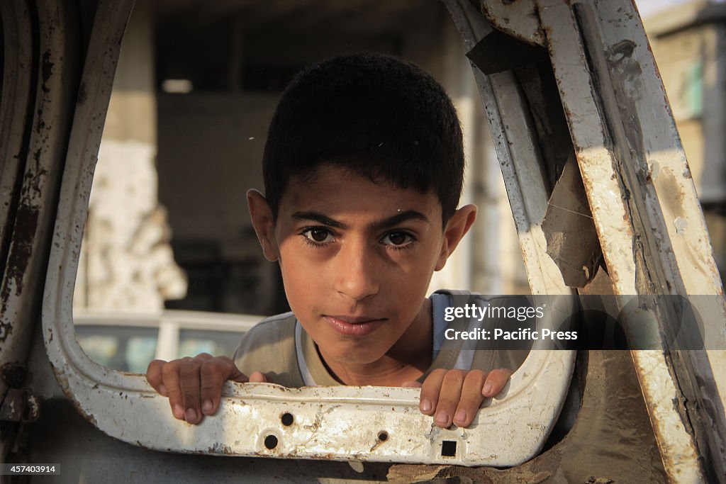 Palestinian child plays on the ruins of their homes in AL...