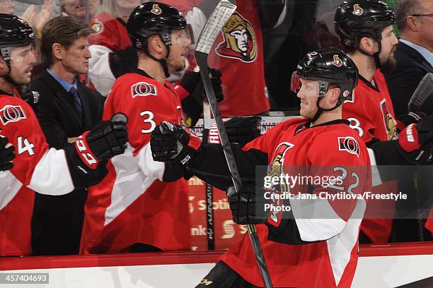 Erik Condra the Ottawa Senators celebrates his third period goal with teammates Chris Phillips and Marc Methot during an NHL game against the Toronto...