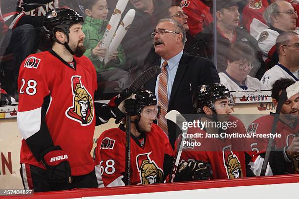 Head coach Paul MacLean of the Ottawa Senators looks on from the bench during an NHL game against the Toronto Maple Leafs at Canadian Tire Centre on...