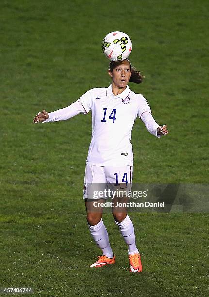 Christen Press of the United States heads the ball against Guatemala during the 2014 CONCACAF Women's Championship at Toyota Park on October 17, 2014...