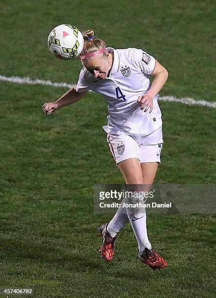 Becky Sauerbrunn of the United States heads the ball against Guatemala during the 2014 CONCACAF Women's Championship at Toyota Park on October 17,...
