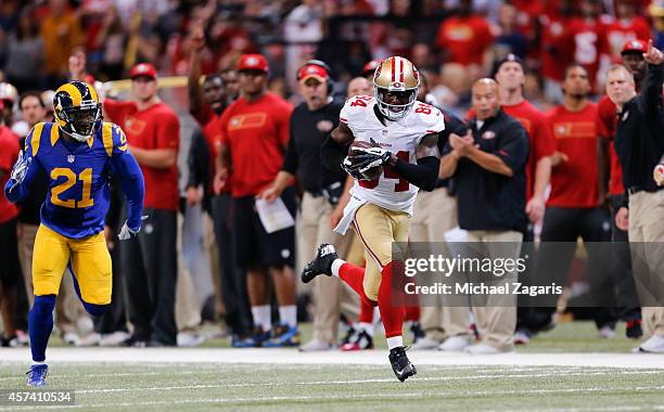 Brandon Lloyd of the San Francisco 49ers makes a reception and takes it downfield on a 80-yard touchdown pass during the game against the St. Louis...