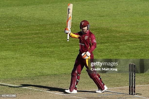 Chris Hartley of the Bulls celebrates and acknowledges the crowd after scoring a century during the Matador BBQs One Day Cup match between Queensland...