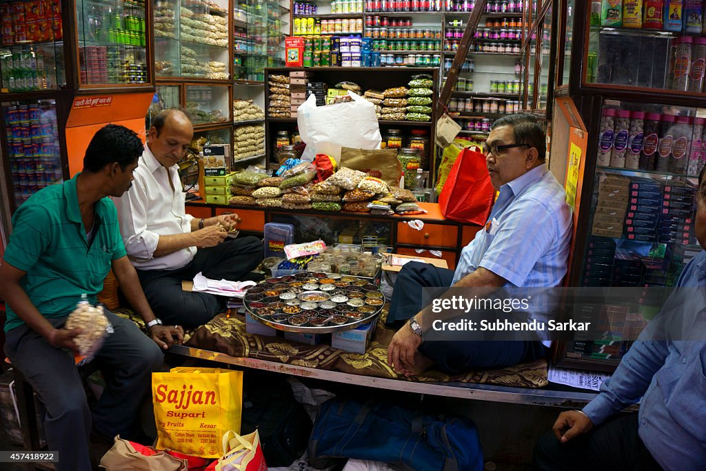 A man sells all kinds of nuts in Burra Bazaar. Burra Bazaar...